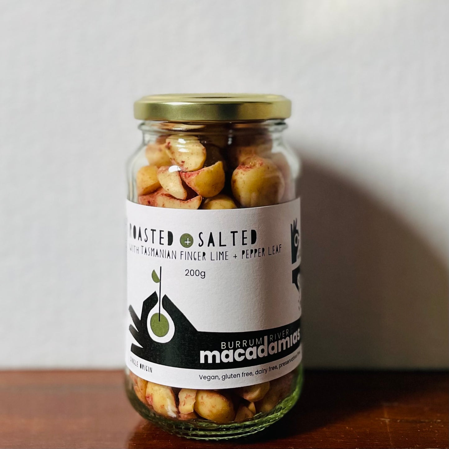 Roasted Macadamias with Finger Lime + Pepper Leaf